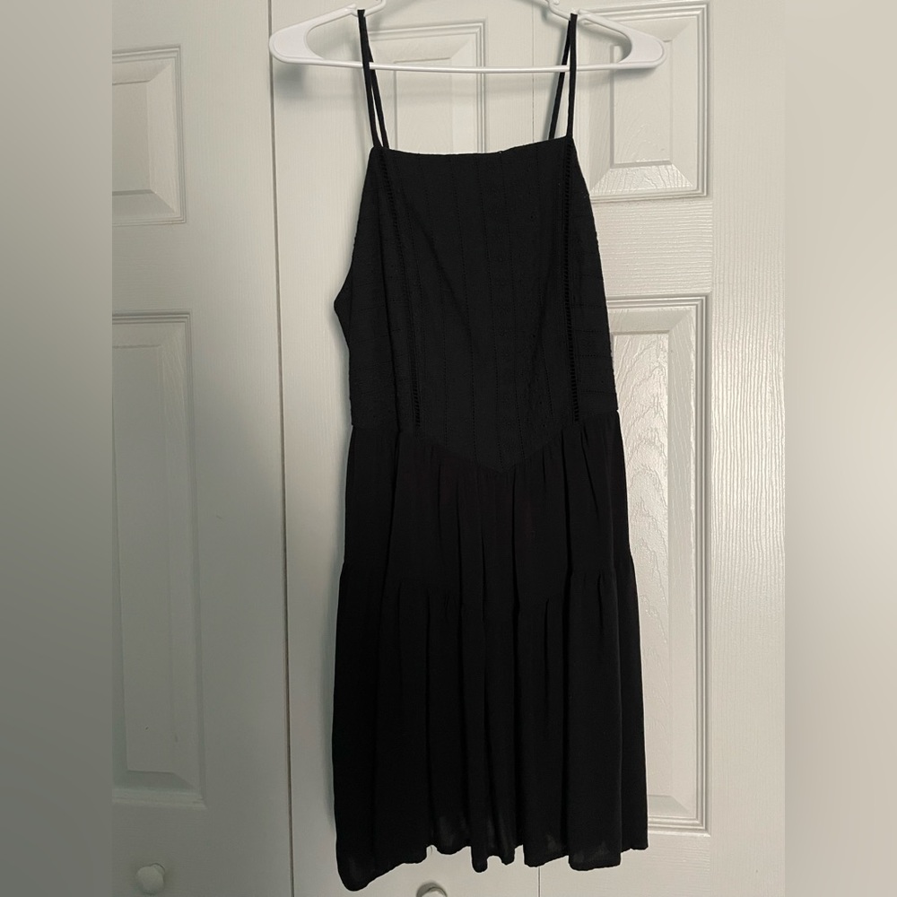 Black flow dress.Pattern on the top part.Perfect for a spring or summer occasion
